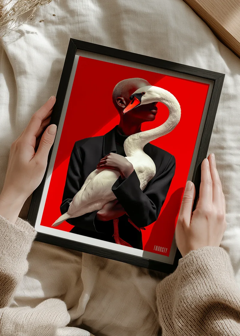 FROOSTY® WOMAN & SWAN – Limited AI fine art print displayed in a modern black frame. A yound Woman holding that frame with both hands – Fine Art Print on Hahnemühle Paper